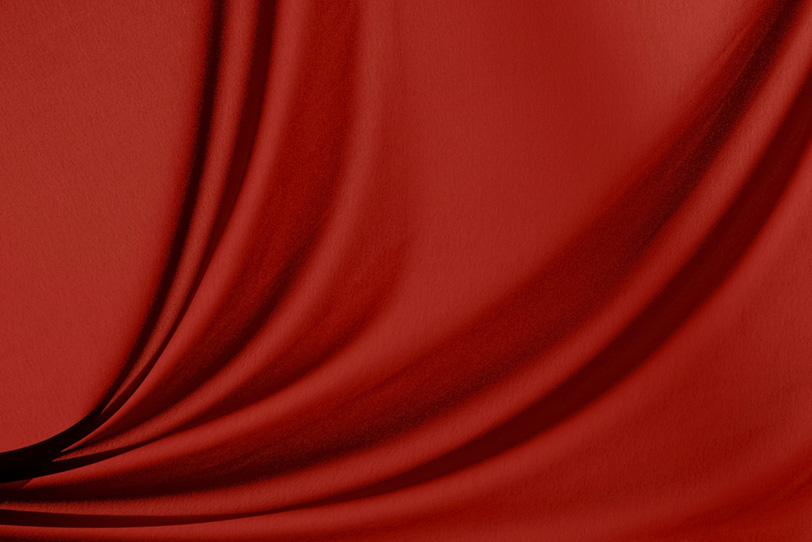 ドレープが美しい赤い布の写真画像