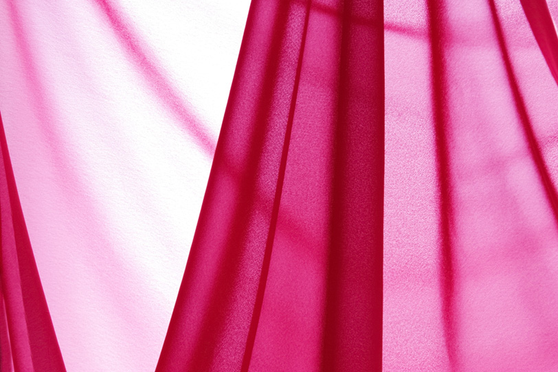 薄いピンク色の布地の写真画像