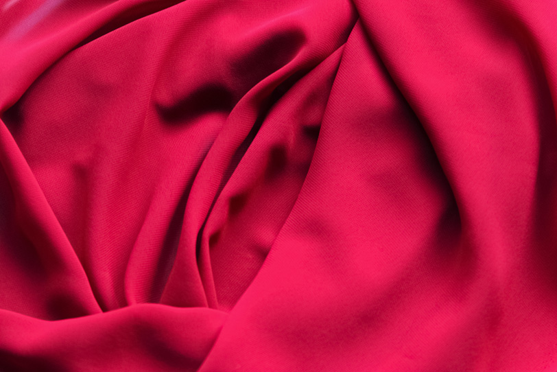 赤いバラの様なテキスタイル素材の写真画像