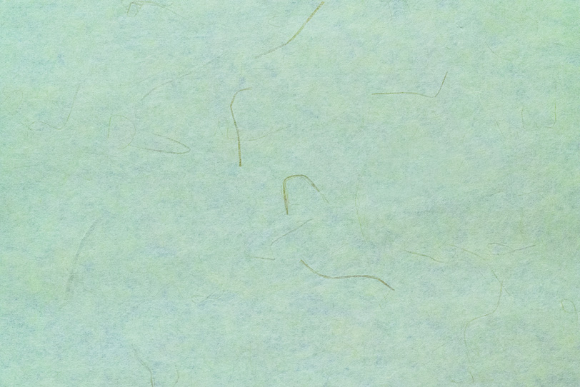 筋の入った山葵色の和紙の写真画像