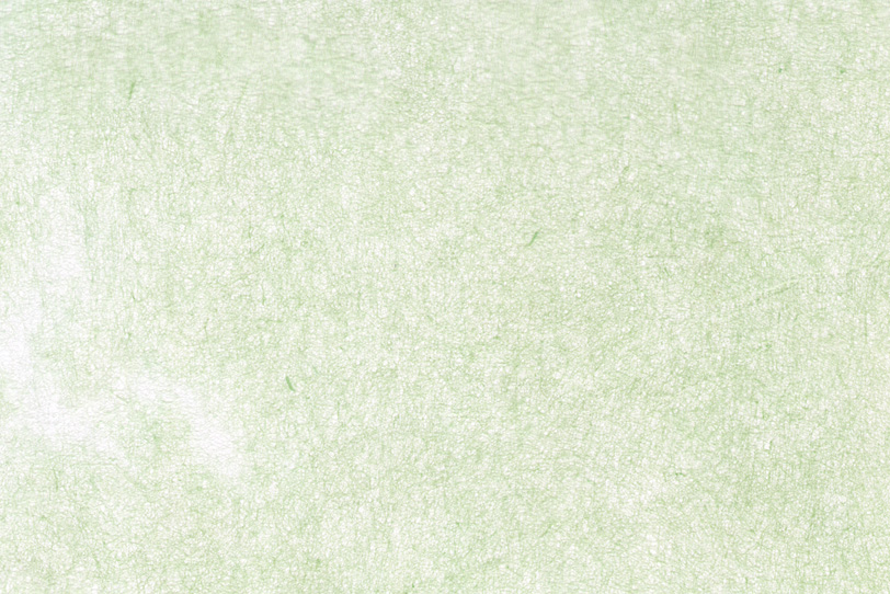 白に薄い緑色が掠れた和紙の写真画像