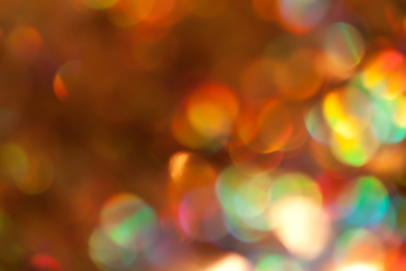 キラキラと反射する虹色の光の写真画像