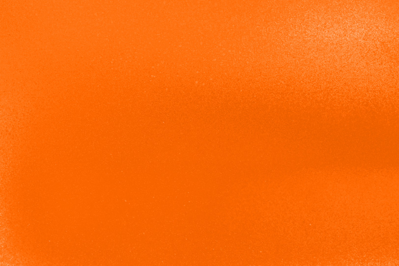 オレンジ色を塗ったシンプルな壁紙