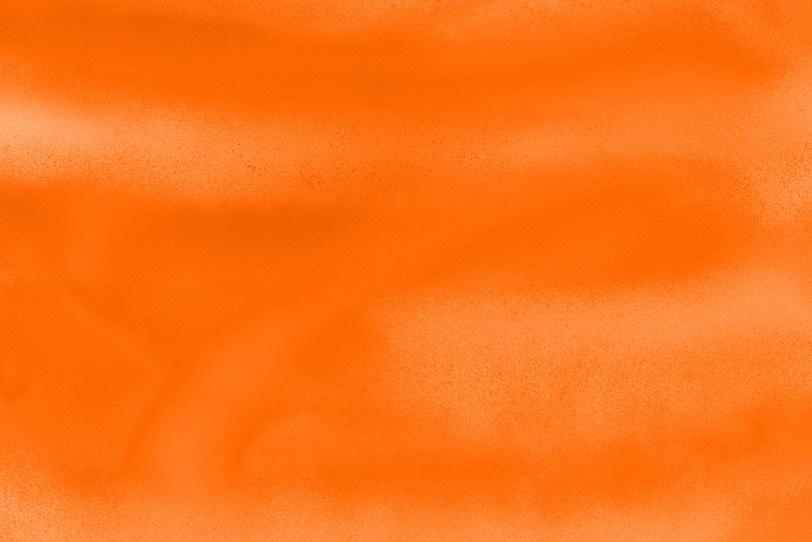 オレンジスプレーのフリー背景素材