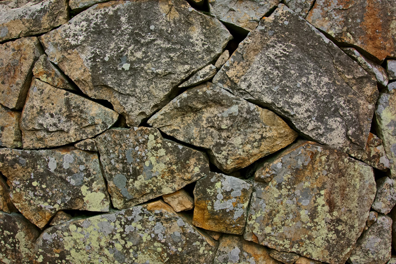 荒い石の表面の塀の写真画像