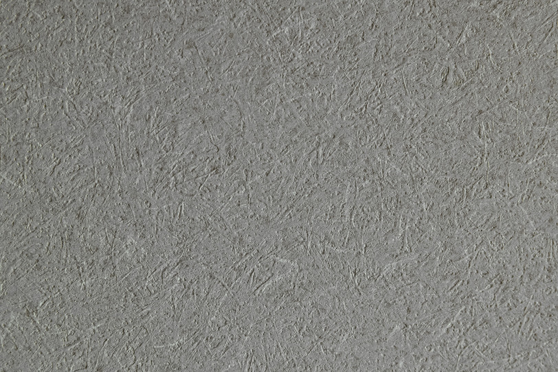 荒いテクスチャの灰色の土壁の写真画像