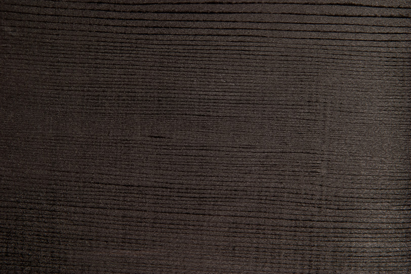 乾燥した黒い板の木目の写真画像