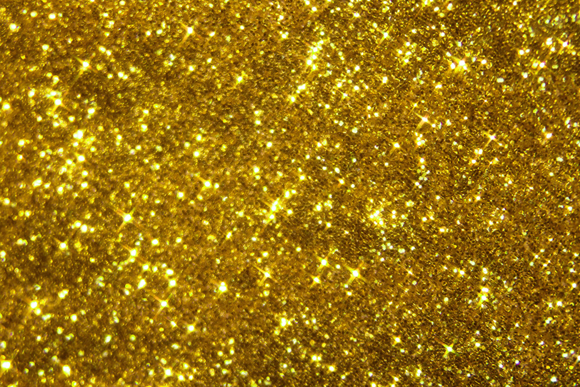 キラキラと輝くゴールドのグリッターの写真画像