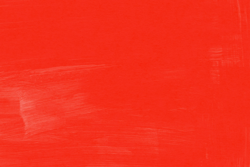 赤の絵具を塗ったシンプルな背景