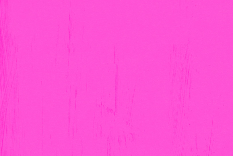 ピンク色の無地壁紙のテクスチャ