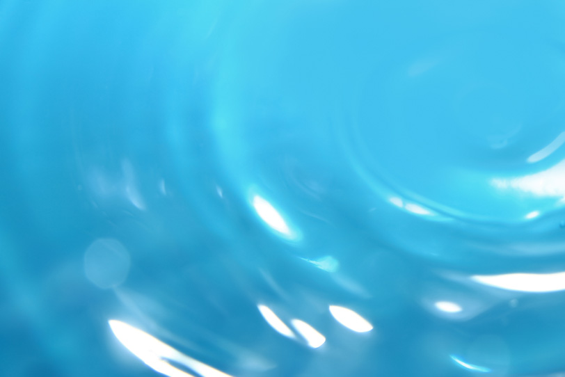 ターコイズブルーの水面背景の写真画像