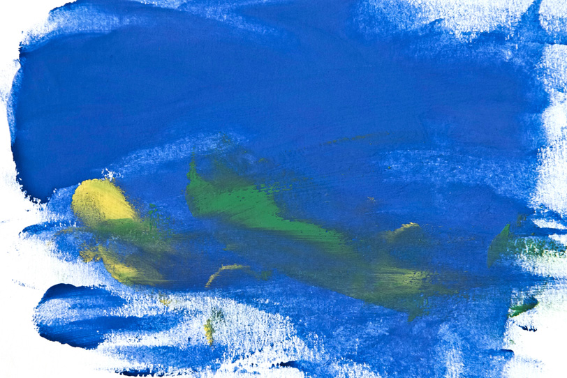青と黄の絵具を塗った画用紙の写真画像