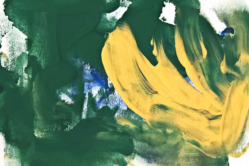 緑と黄の水彩絵の具が混ざる背景の写真画像