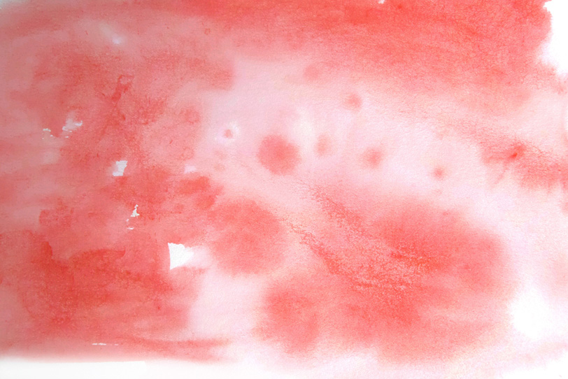 シグナルレッドの水彩テクスチャの写真画像