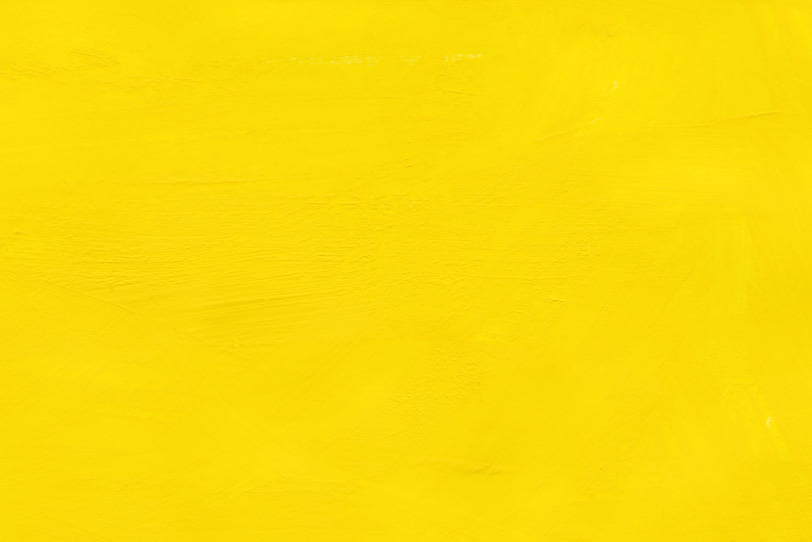 黄色の無地のテクスチャ壁紙
