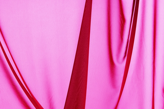 ピンクの布の背景素材（布 テキスタイルの背景フリー画像）
