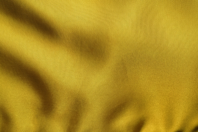 金色の高級感ある生地のテクスチャ（布 背景のフリー画像）
