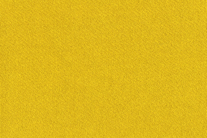 黄色い伸縮性のある布素材の背景（背景 無地の背景フリー画像）