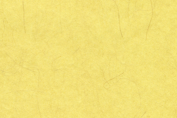 楮の繊維が入った黄蘗色の和紙（和紙 黄色の背景フリー画像）