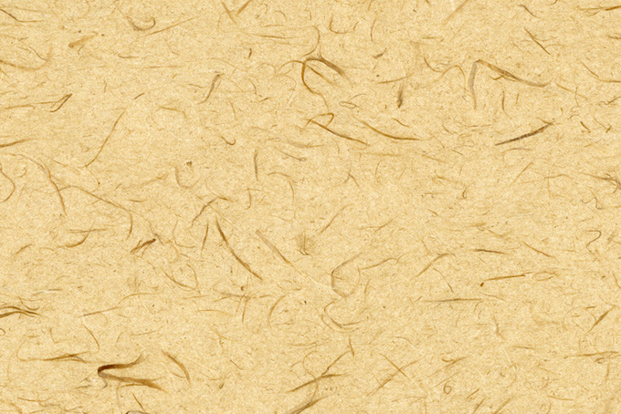 楮の繊維の入った丁子色の和紙背景（和紙 素材の背景フリー画像）