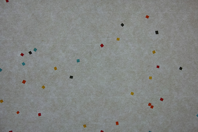 素鼠色の紙に沢山の色柄模様がある和紙（和紙 柄の背景フリー画像）