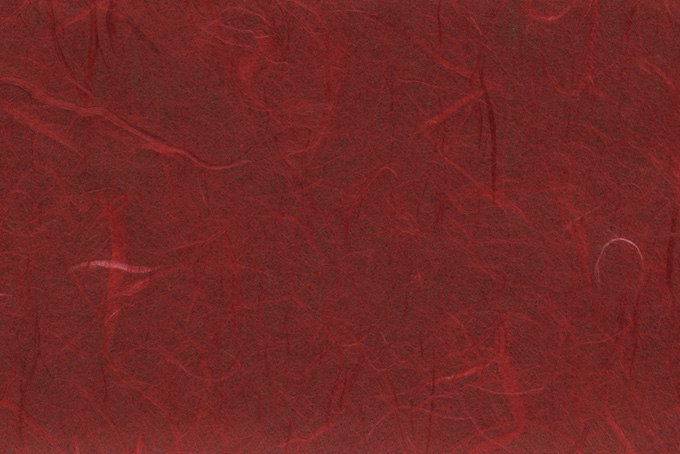 濃染めの赤茶色をした雲龍和紙（和紙 赤色の背景フリー画像）