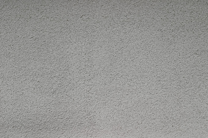 ザラザラとしたモルタル壁のテクスチャ（コンクリート 壁紙 写真の背景フリー画像）