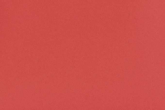 鮮やかな赤色の折紙（テクスチャ 素材の背景フリー画像）